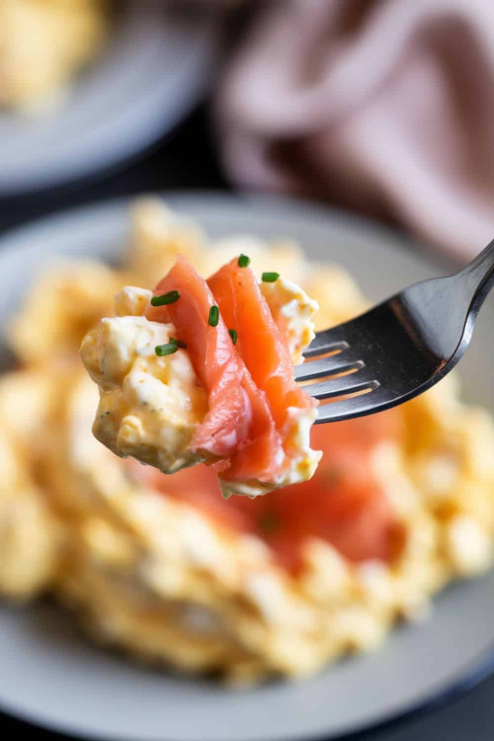 a bite of Scrambled Eggs with Smoked Salmon