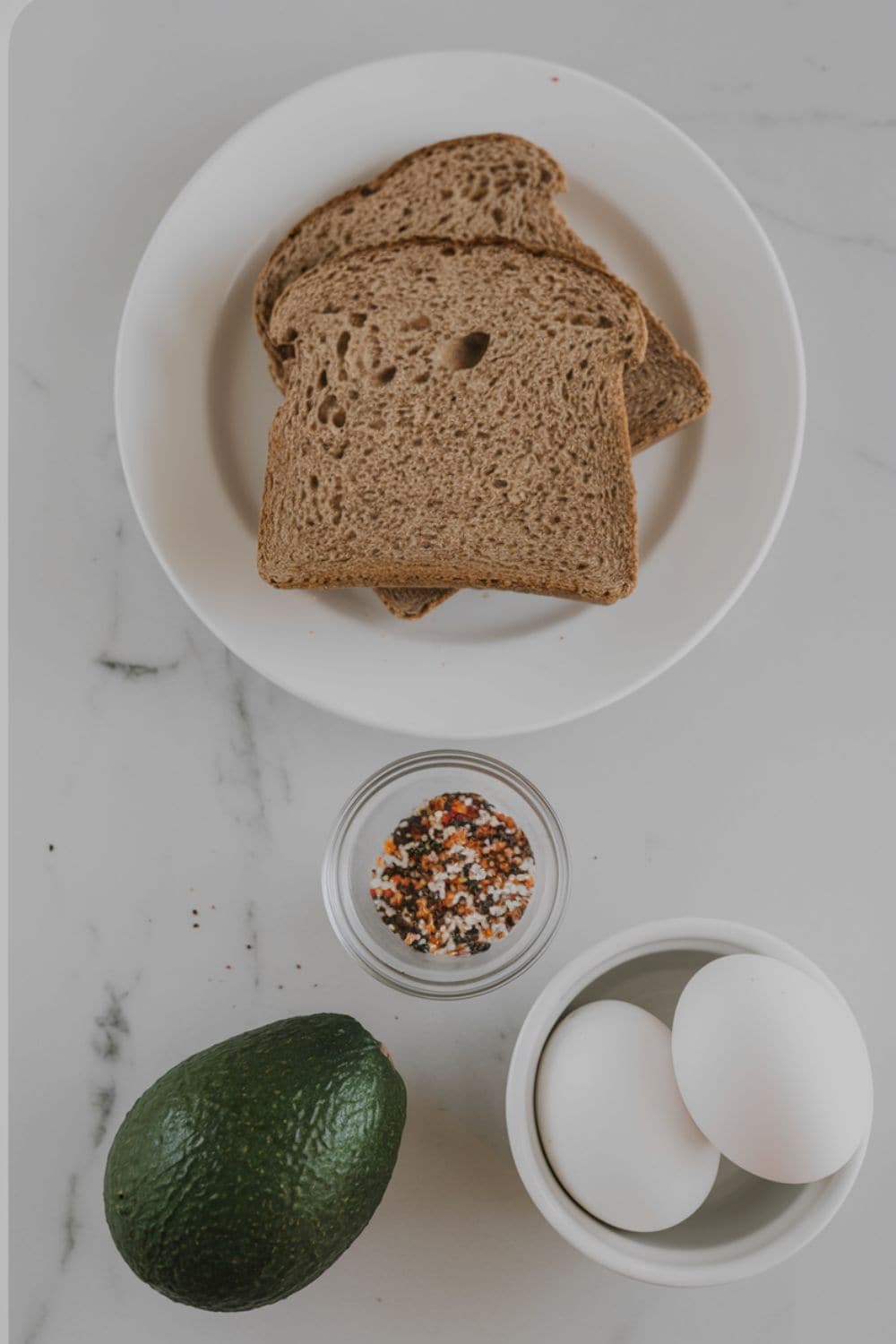 top down view of ingredients for Hard-Boiled Egg and Avocado Toast